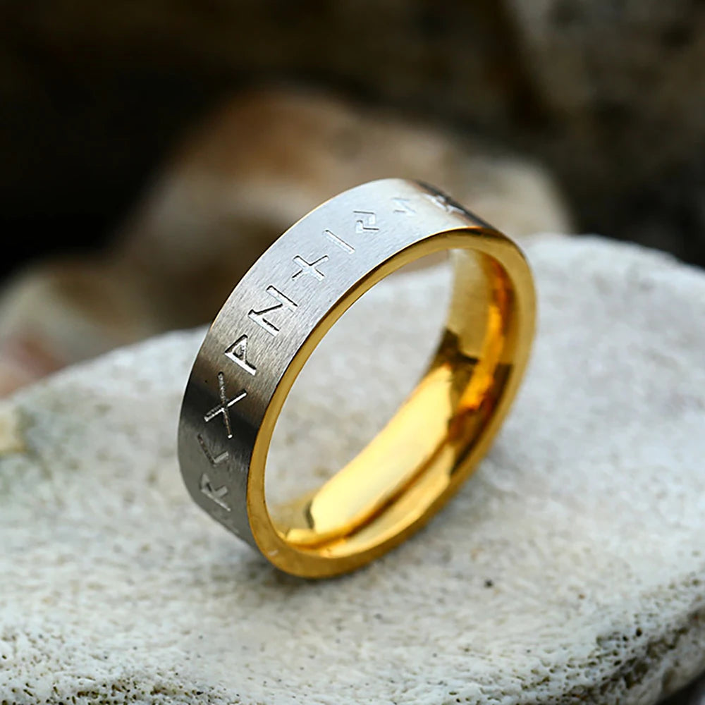 Viking-inspired gold and silver rune ring with Norse engravings