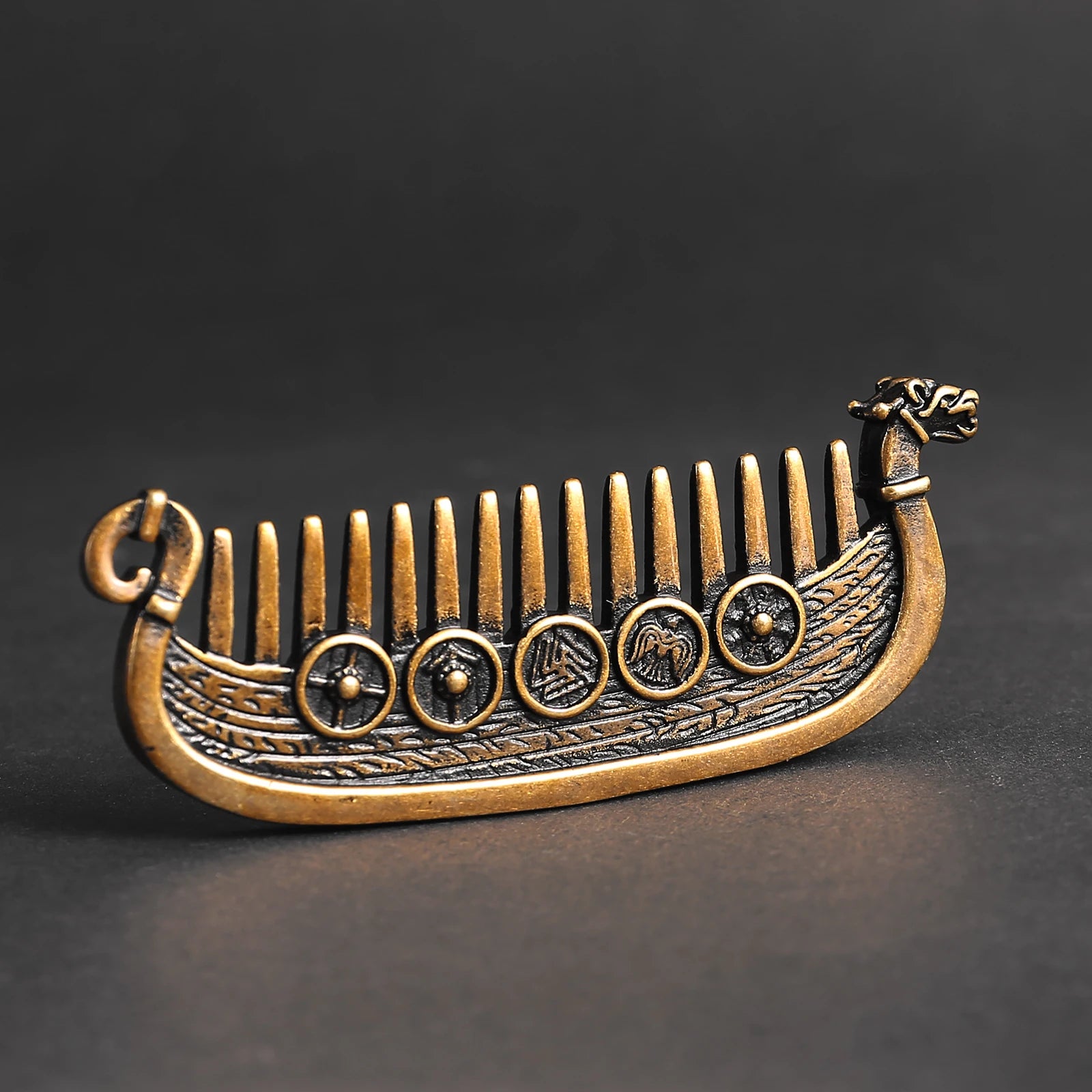 Viking longship hair comb with dragon head prowl and shield designs