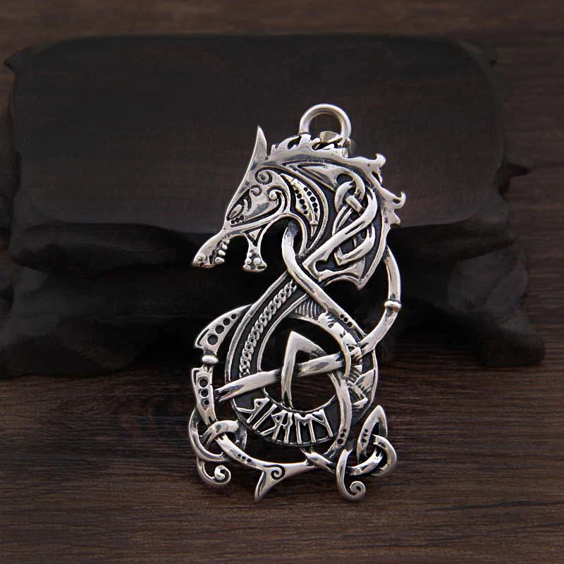 Silver pendant inspired by Ringerike art and Elder Futhark designs.