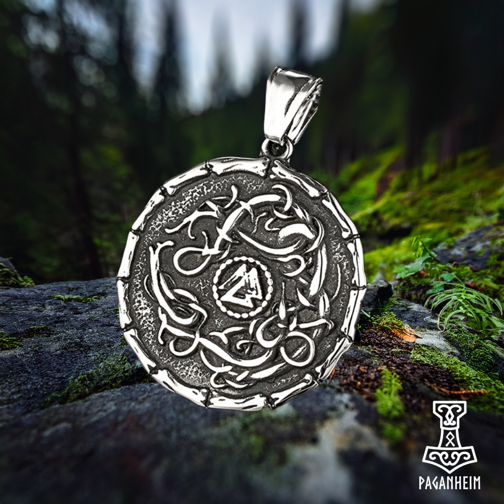 Viking amulet showing Valknut within serpent-decorated shield
