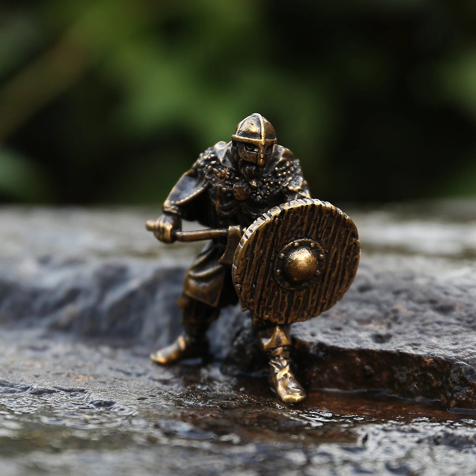 Crafting bead depicting a Viking warrior with Gjermundbu helmet, shield, and axe.