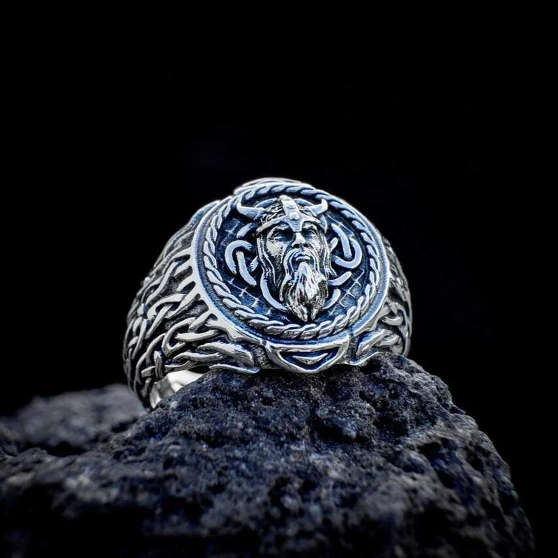 Norse mythology-inspired ring with an engraved Viking warrior face and Web of Wyrd patterns, representing fate and destiny.