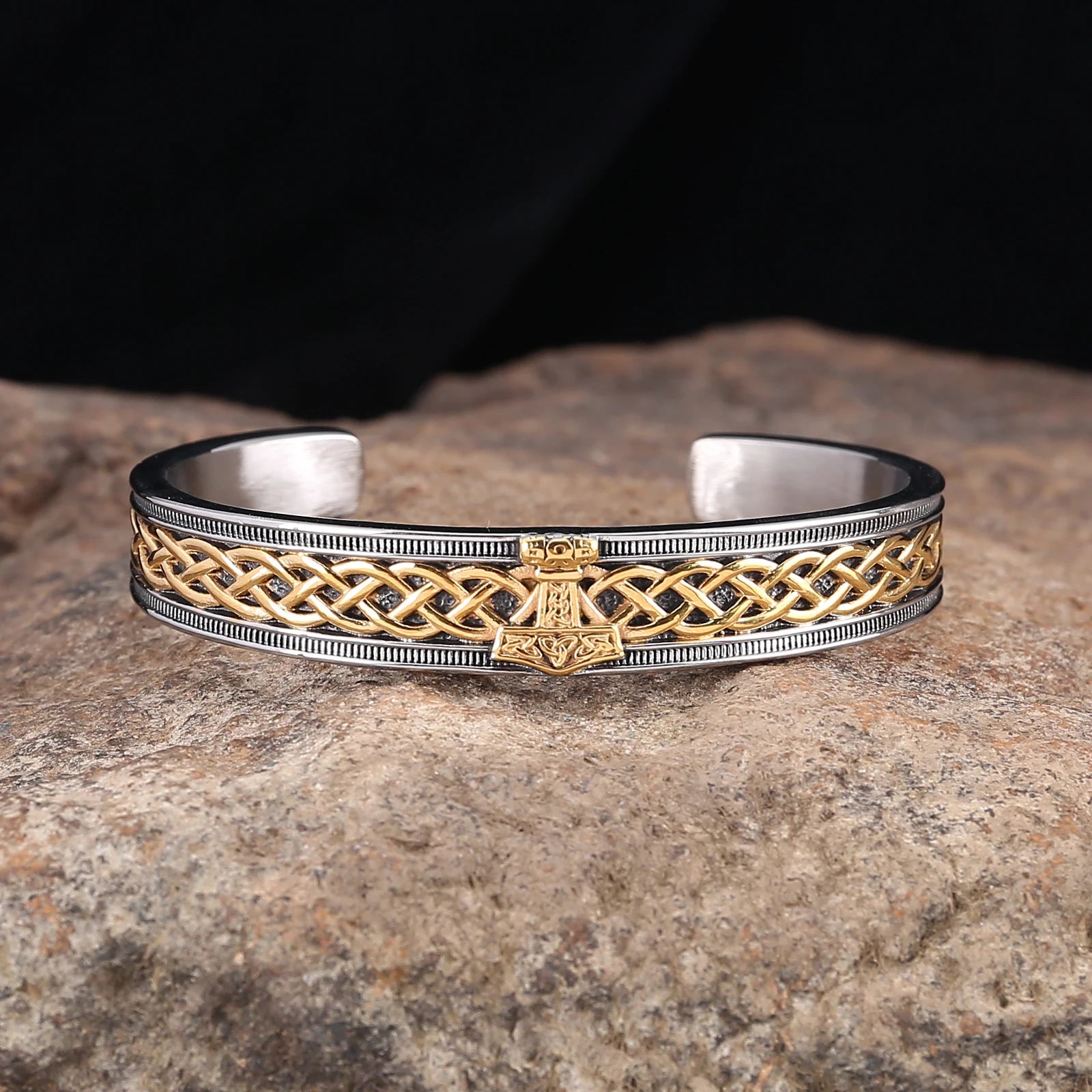 Cuff bracelet featuring Web of Wyrd design and Mjölnir symbol, available in gold and silver.