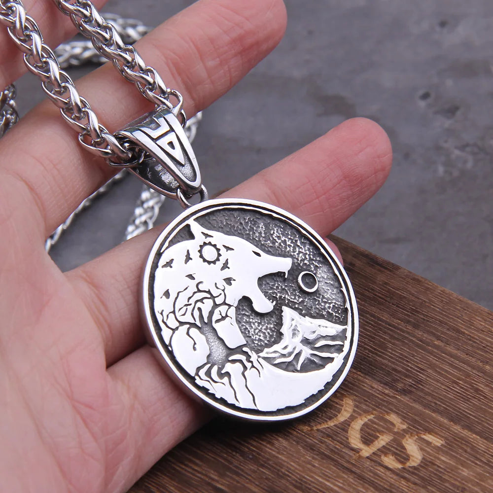 Close-up of the Hati pendant, showing the cosmic hunt with ravens around the sun.