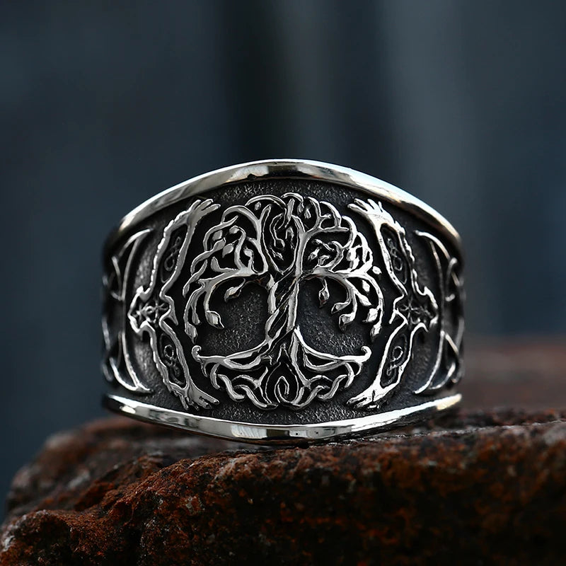 Close-up of a Yggdrasil ring with eagle symbols on either side.